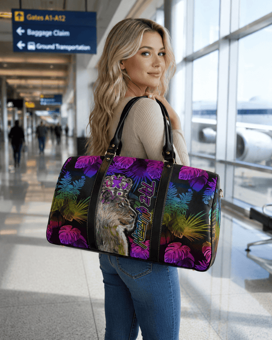 Woman holding a colorful handbag with a cat design in an airport.