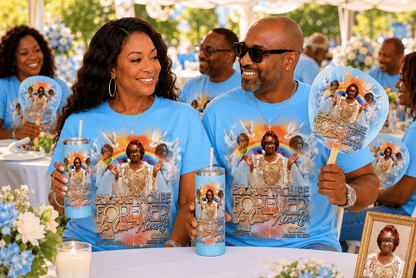 Personalized memorial gift collection with custom memorial tumblers 20 oz skinny tumblers, memorial fans with wooden handles, and memorial ribbons displayed for guests at an outdoor celebration of life event.